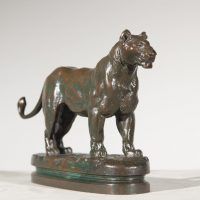 Alt text: Bronze sculpture of a standing Algerian lioness 