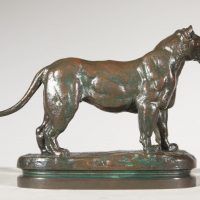 Alt text: Bronze sculpture of a standing Algerian lioness 