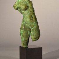 Alt text: Bronze sculpture of a torso