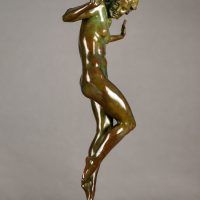 BAlt text: ronze sculpture of a nude woman posing with hands up
