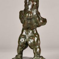 Alt text: Bronze sculpture of a bear standing tall on his hind legs