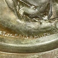 Alt text: Bronze sculpture, base detail