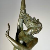 Alt text: Bronze sculpture of a woman