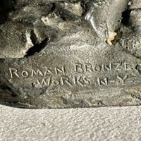 Alt text: Roman Bronze Works foundry mark on bronze sculpture