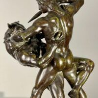 Alt text: Bronze sculpture of a man fighting a minotaur