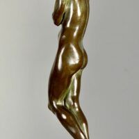 Alt text: Bronze sculpture of a woman holding grapes