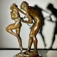 Alt text: bronze sculpture of two people