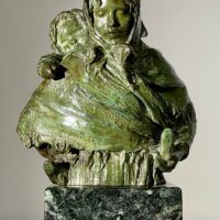 Alt text: Bronze sculpture of woman with child on her back