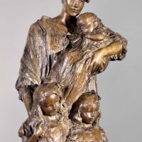 Alt text: Bronze sculpture of a mother with her baby and two daughters