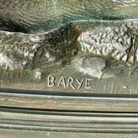 Alt text: signature detail of a bronze sculpture 