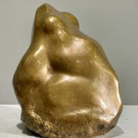 Alt text: Bronze sculpture of a frog