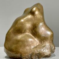 Alt text: Bronze sculpture of a frog