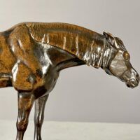 Alt text: bronze sculpture of a half blood horse