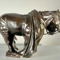Alt text: Bronze sculpture of two horses