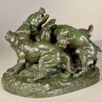 Alt text: Bronze sculpture of a bear attacked by hounds