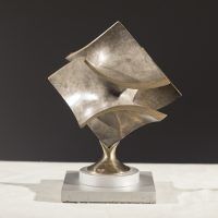 Alt text: Abstract bronze sculpture of two distorted and conjoined squares