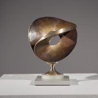 Alt text: Abstract bronze sculpture of a single distorted and conjoined circle