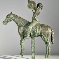Alt text: Bronze sculpture of an American Indian on horseback 