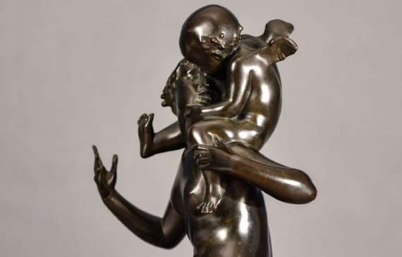 Alt text: Bronze sculpture of Psyche seated with Cupid on her shoulders