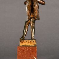 Alt text: Bronze sculpture of an angel playing flute