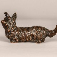 Alt text: Bronze sculpture of a Scottish terrier