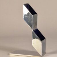 Alt text: Geometric metal sculpture