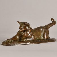 Alt text: Bronze sculpture of a cat stretching
