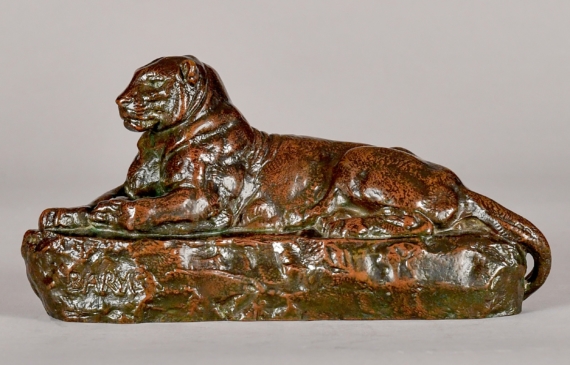 Alt text: Bronze sculpture of a lounging Indian panther