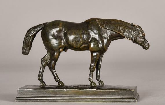 Alt text: Bronze sculpture of a half blood horse