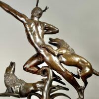 Alt text: Bronze sculpture of Actaeon with dogs, back