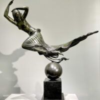 Alt text: Bronze sculpture of a floating woman