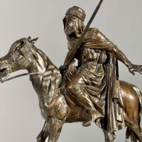 Alt text: Bronze sculpture of a man on a horse