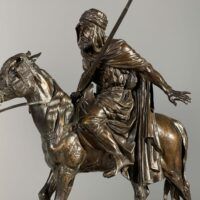 Alt text: bronze sculpture of man on horse