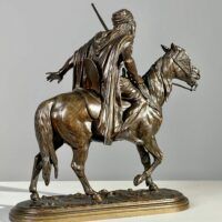 Alt text: back view of man on horse
