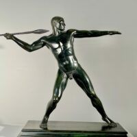 Alt text: Bronze sculpture of man with a spear