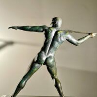 Alt text: Bronze sculpture of man with a spear