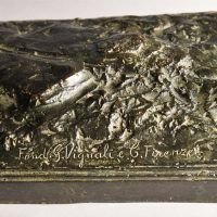 Alt text: Detail of base of Washington sculpture, inscribed by foundry 