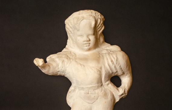 Plaster figure of a circus performer, frontal view