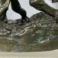 Alt text: Detail of cowboy sculpture, inscribed on base with foundry mark ROMAN BRONZE WORKS N – Y –