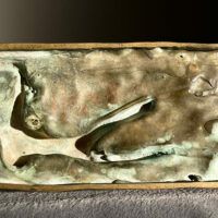 Alt text: Underside detail of a bronze sculpture