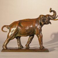 Alt text: Bronze sculpture of a trumpeting elephant, side view