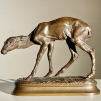 Alt text: Bronze sculpture of a young fawn