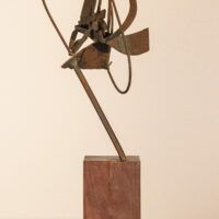 Alt text: Abstract bronze sculpture