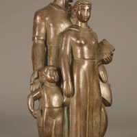 Alt text: Bronze sculpture of a family with father, mother, and child, right facing view