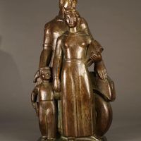 Alt text: Bronze sculpture of a family with father, mother, and child, frontal view