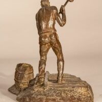 Alt text: Bronze sculpture of a railroad worker