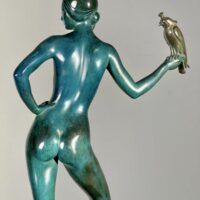 Alt text: Bronze sculpture of Charmion holding a falcon