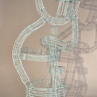 Alt text: Abstract wire sculpture of a musician