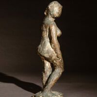 Alt text: Bronze sculpture of a standing nude 