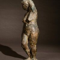 Alt text: Bronze sculpture of a standing nude 